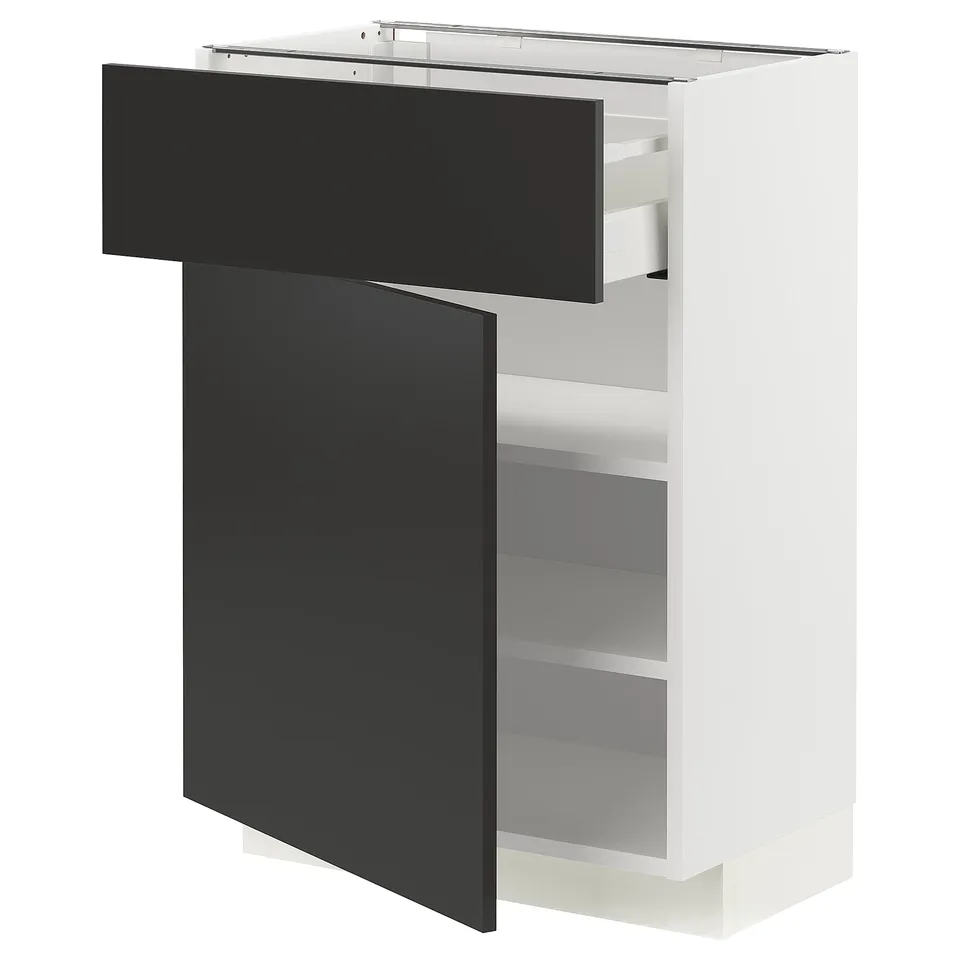 A white METOD kitchen unit with black nickebo doors, featuring adjustable shelves and a smooth-closing drawer.