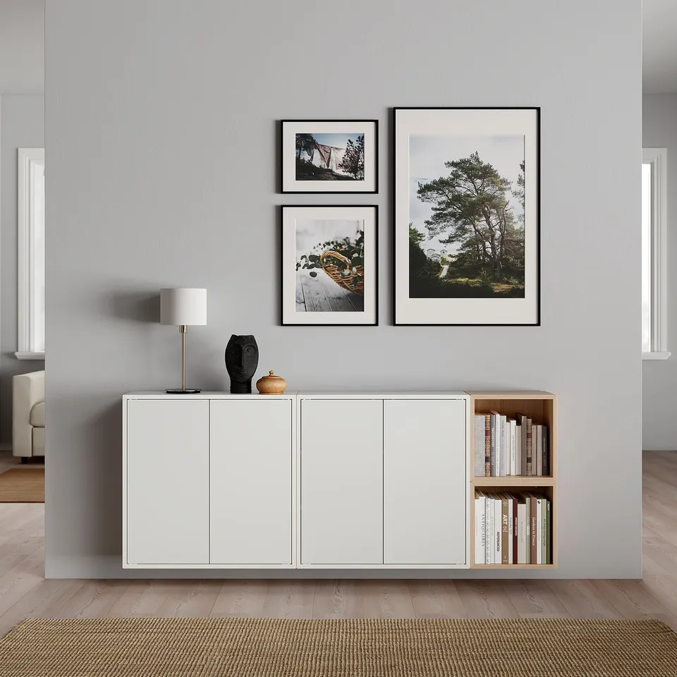 Grey living room with EKET shelves, nature photos, lamp, and rug.