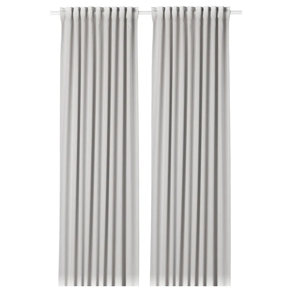 Two MAJGULL white curtains with a simple design, featuring room-darkening fabric and heading tape.