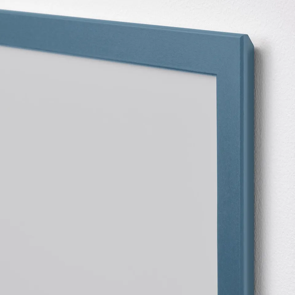 Blue picture frame, high-quality design. Securely mounted, empty interior.