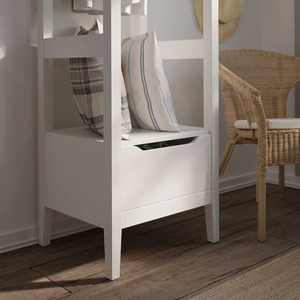 White IDANÄS storage unit with adjustable shelves, made of wood and medium-density fiberboard, designed for organising clothes at home.