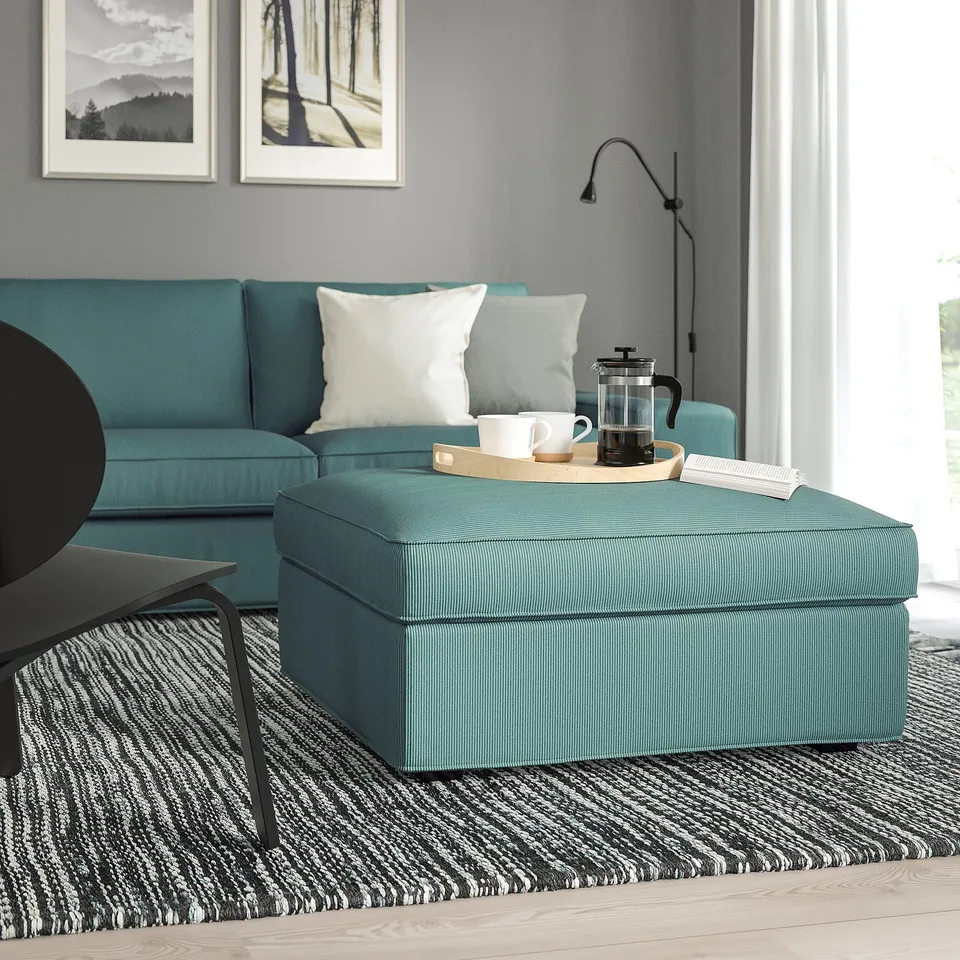 Teal KIVIK footstool & sofa, living room setup with storage.