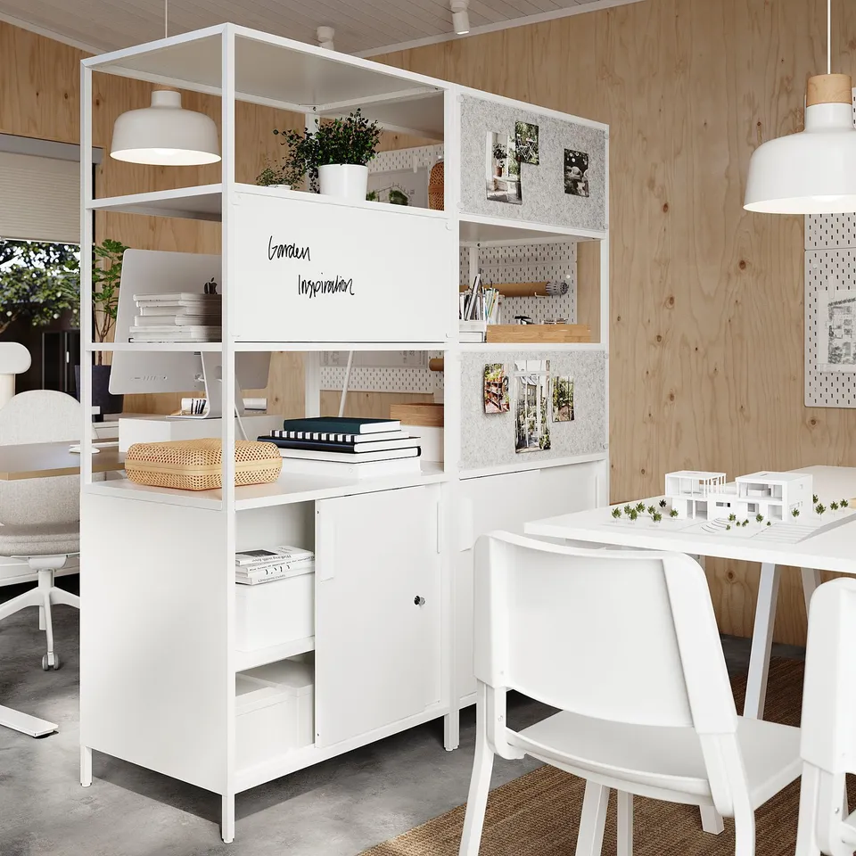 White TROTTEN storage unit with open/closed compartments, ideal room divider, includes desk and adjustable shelves.
