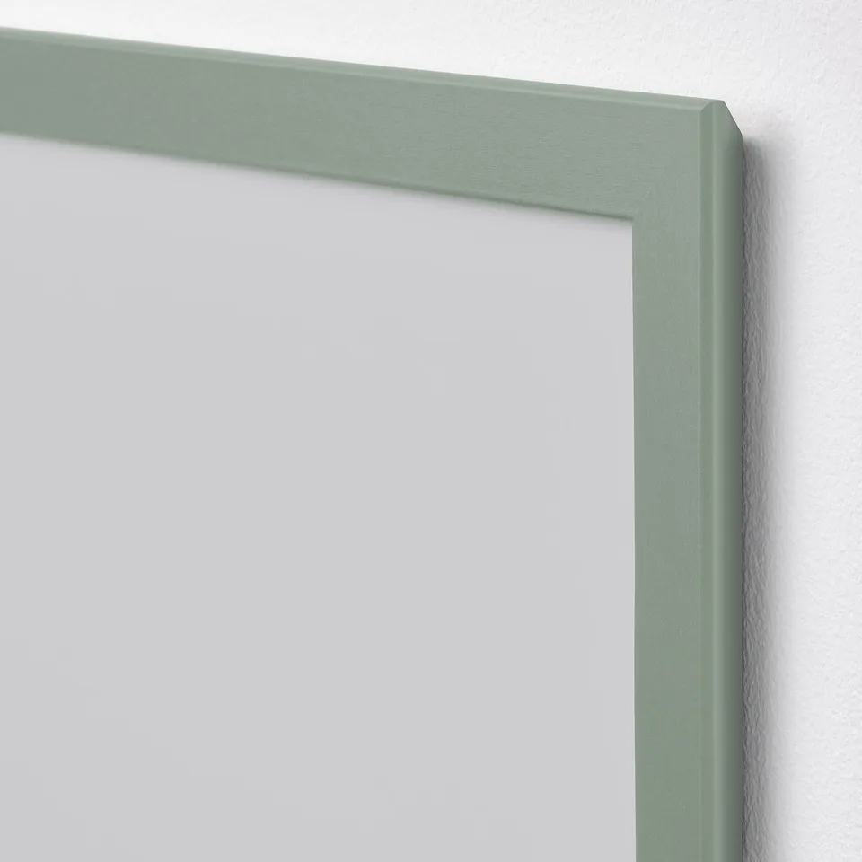A close-up of a modern, high-quality green frame, showcasing its durable material and clean edges.