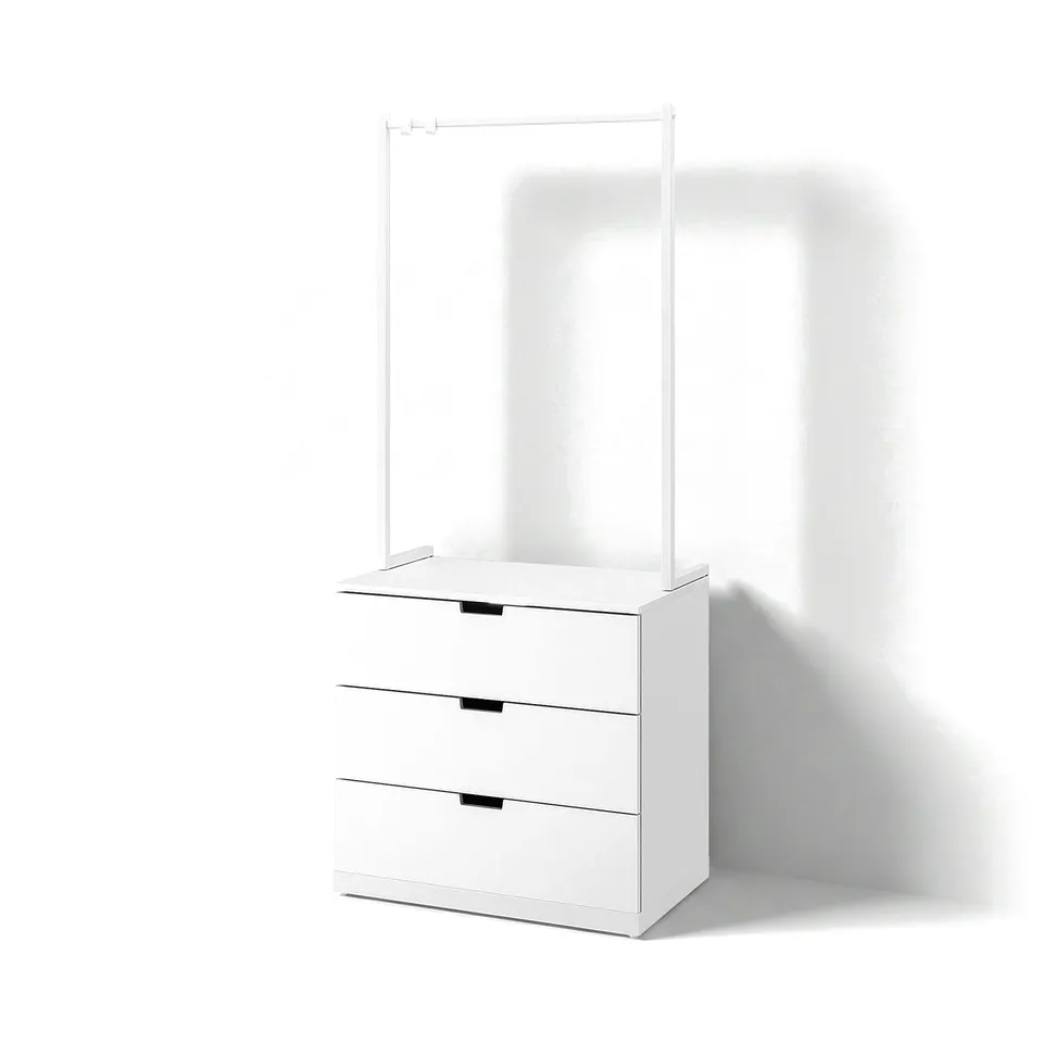 A white NORDLI chest of drawers with three drawers and a top clothes rail. Modern and minimalist design.