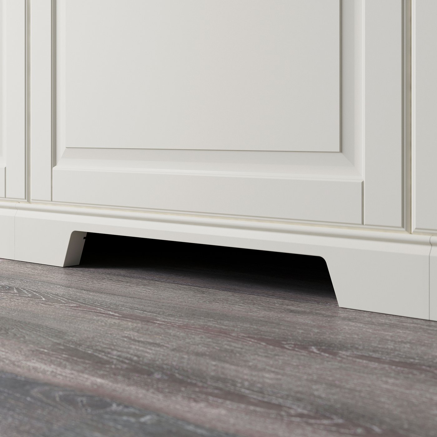 A modern kitchen plinth with a cut-out for ventilation, covering the gap between the floor and base cabinets.