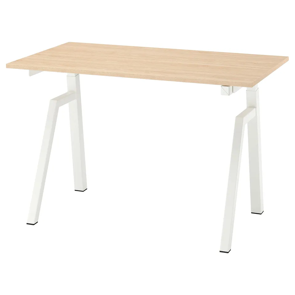 Simple modern desk with light wood top, white metal legs, adjustable height.