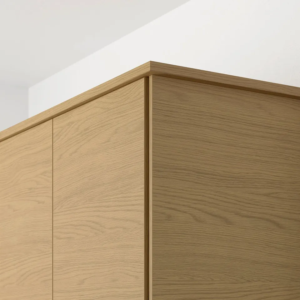Wooden cabinet detail shows smooth, light-colored oak finish and clean, modern edges.