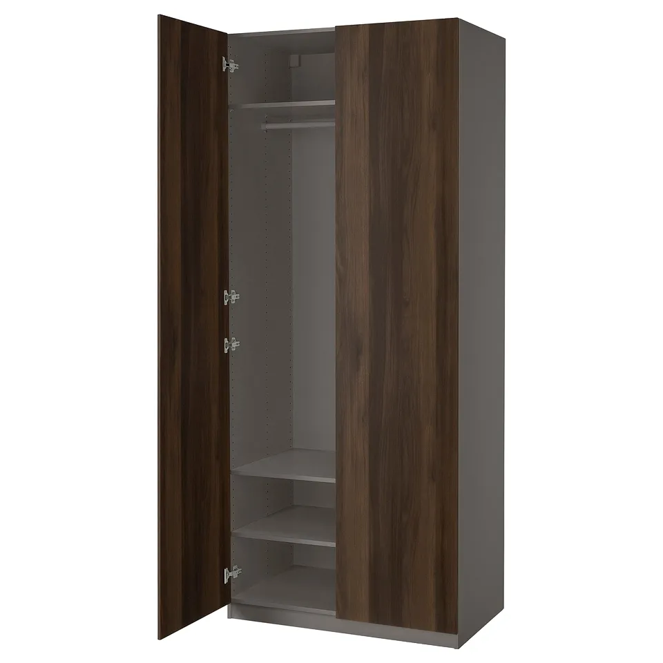 Dark brown wooden wardrobe, PAX brand, with soft-close hinges, three shelves, and hanging rod.