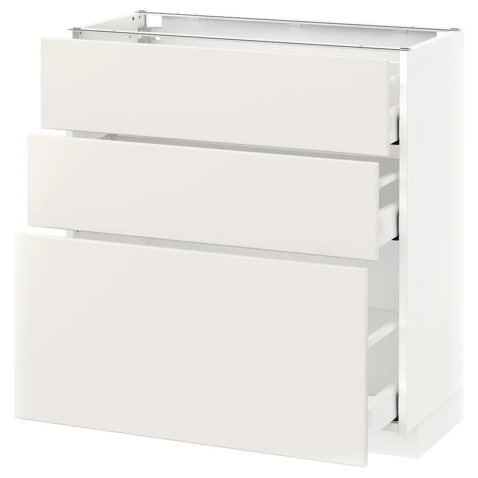 A white METOD kitchen cabinet with three drawers and a top shelf. It a modern design with clean lines and smooth surfaces.