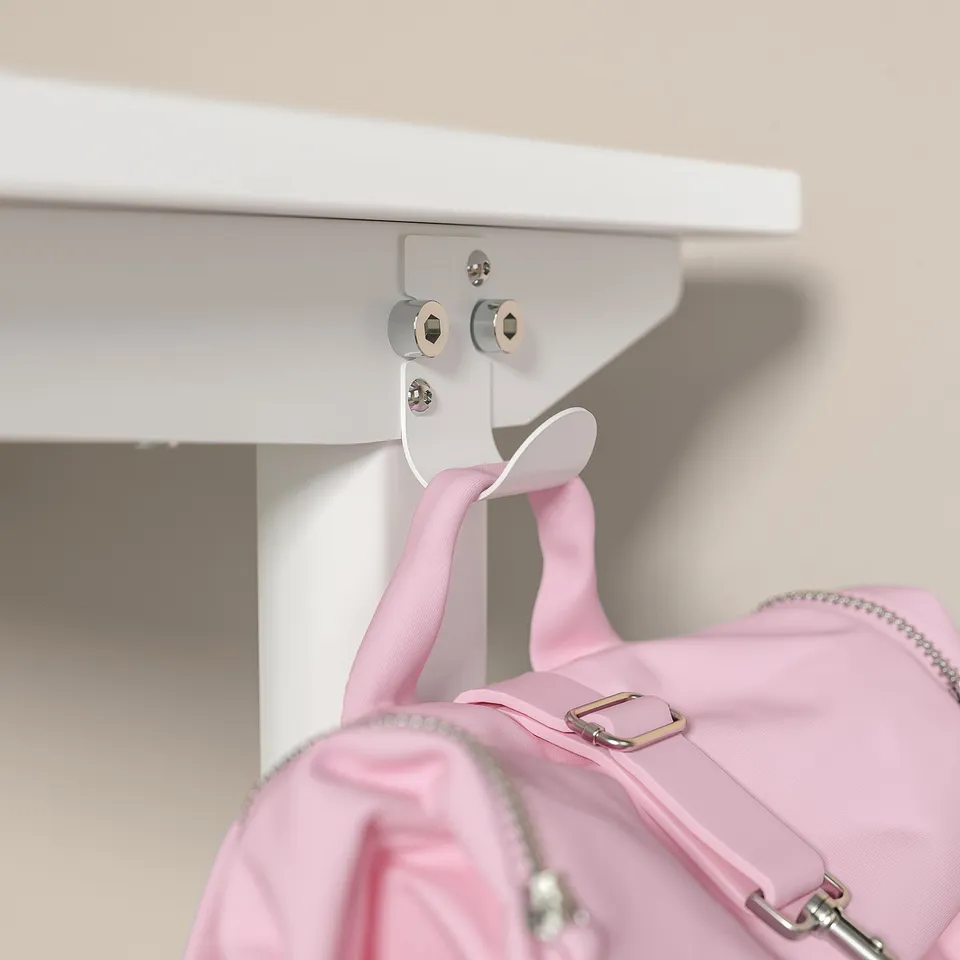 A white RELATERA desk with a pink backpack hook. The hook holds a pink bag. The desk has a clean, modern design.