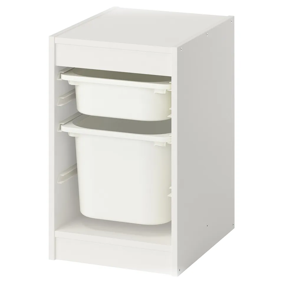 A white ikea TROFAST storage unit with three stacked plastic bins, perfect for organizing childrens toys or items.
