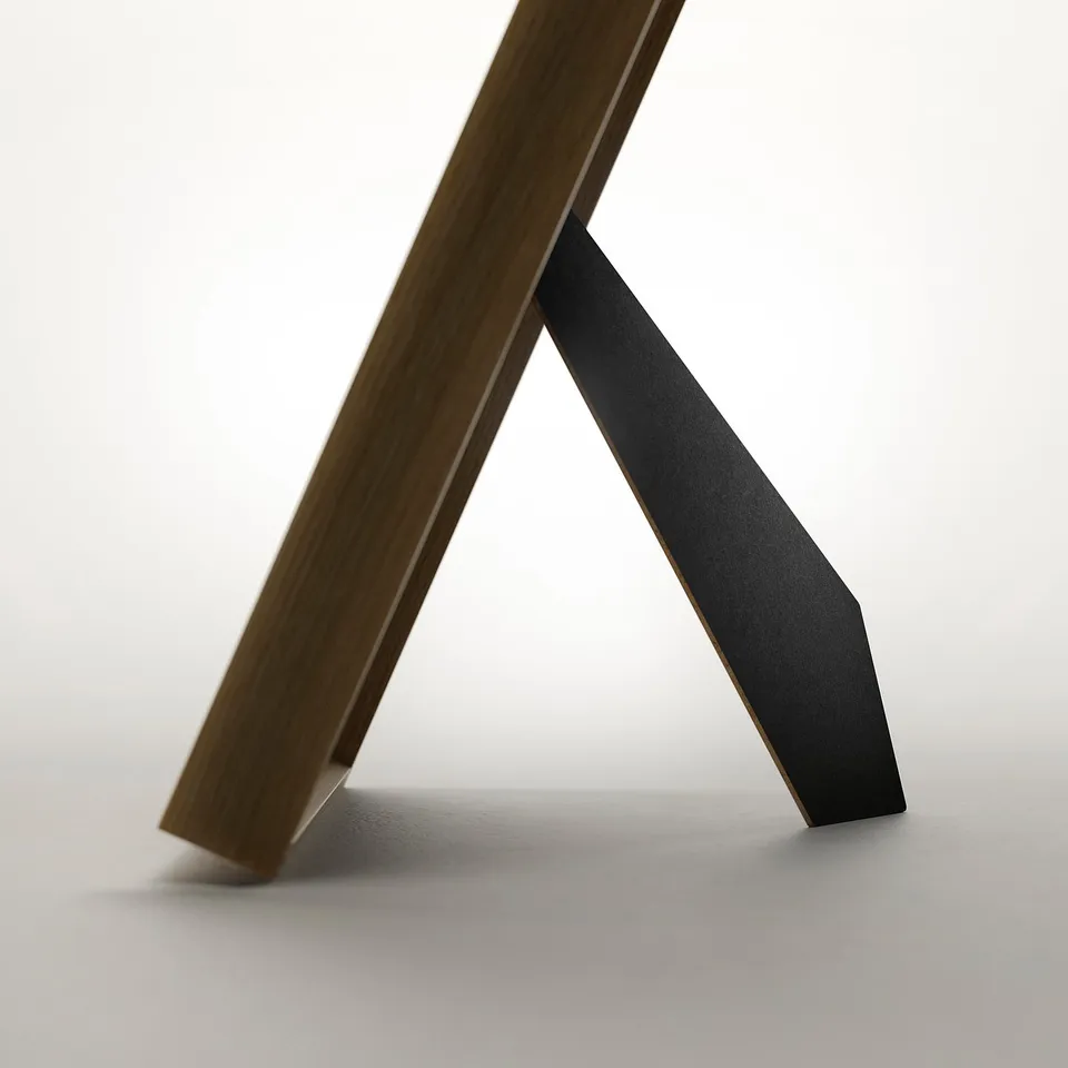 A sleek, angled wooden frame designed to showcase pictures either horizontally or vertically. Its modern style enhances anyfavorite photograph.