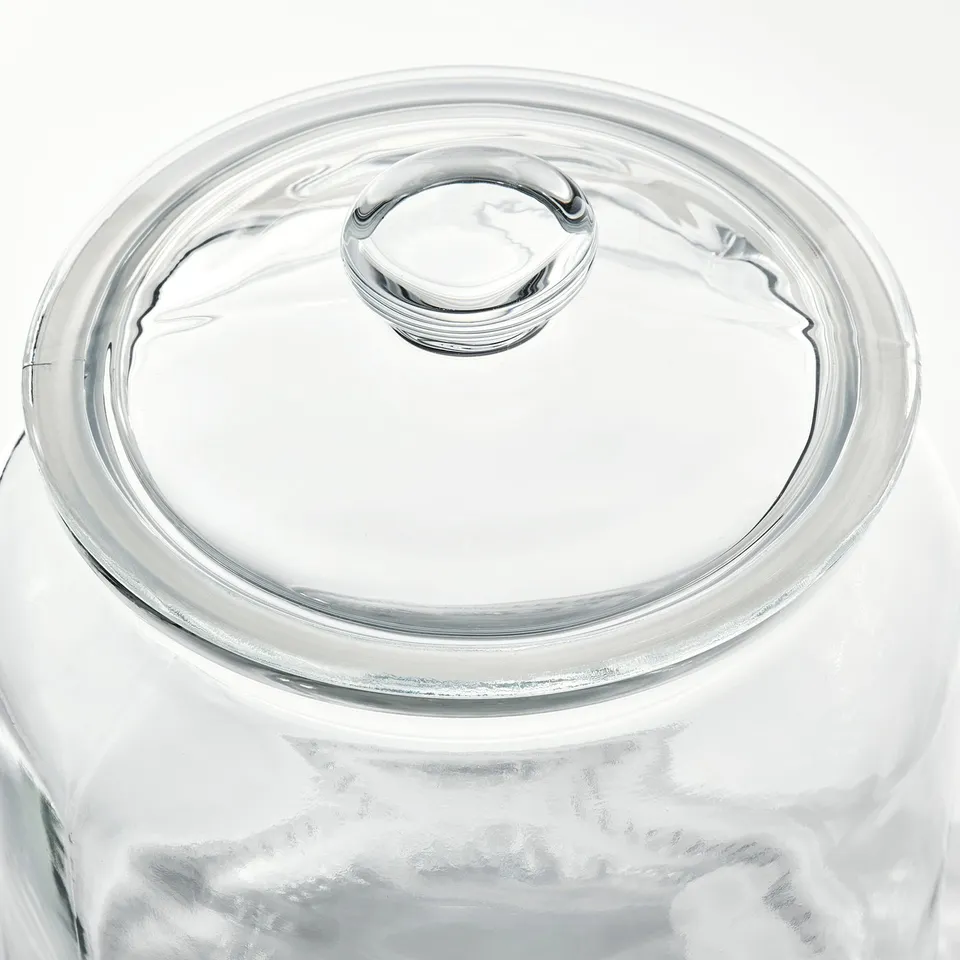 Clear glass jar with lid, showing quality and design. Transparent body for easy viewing of contents.