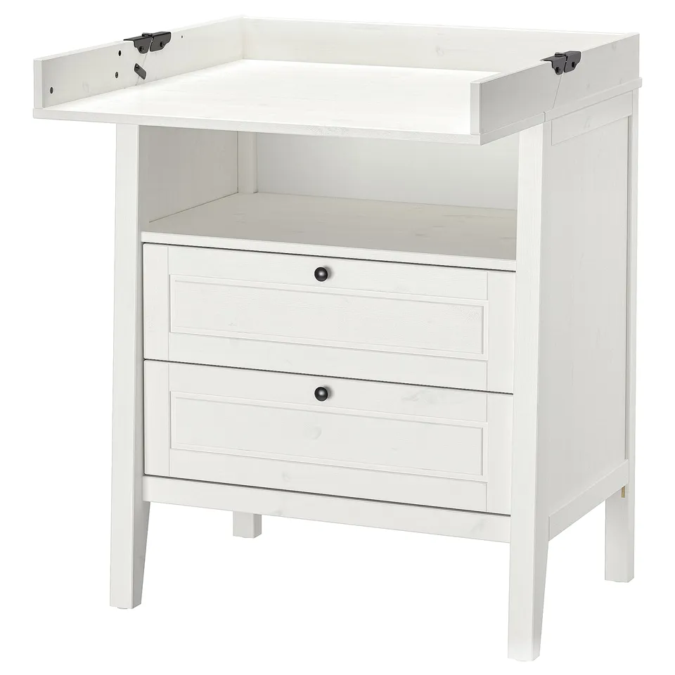 A white wooden SUNDVIK changing table with drawers. It a top shelf and a foldable changing board.