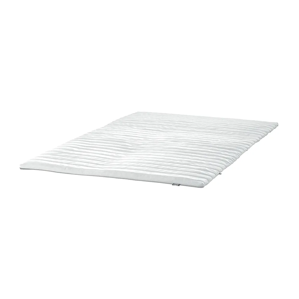 White mattress topper, rectangular, textured surface.