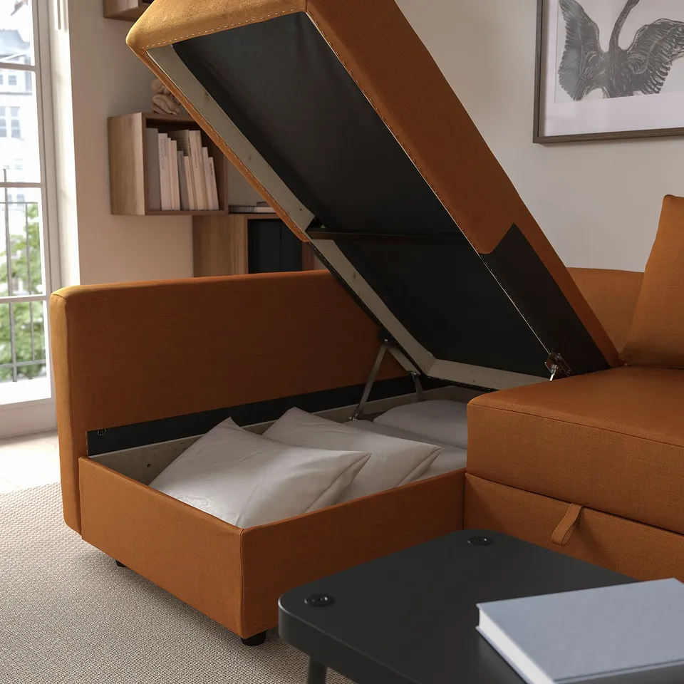 Sleeping sofa with pull-out bed and storage.