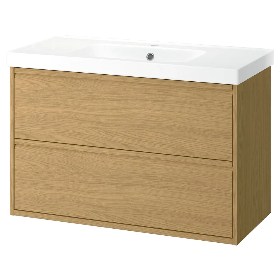 Modern oak vanilla bathroom cabinet with minimalist design, two drawers, and white ceramic sink.