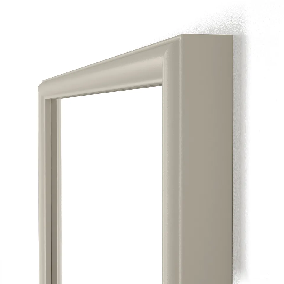 Modern mirror with sleek beige frame, mounted on white wall.