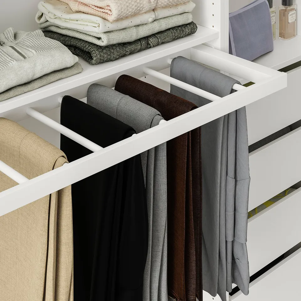 Organised wardrobe with pull-out trouser hanger holding multiple pants neatly.
