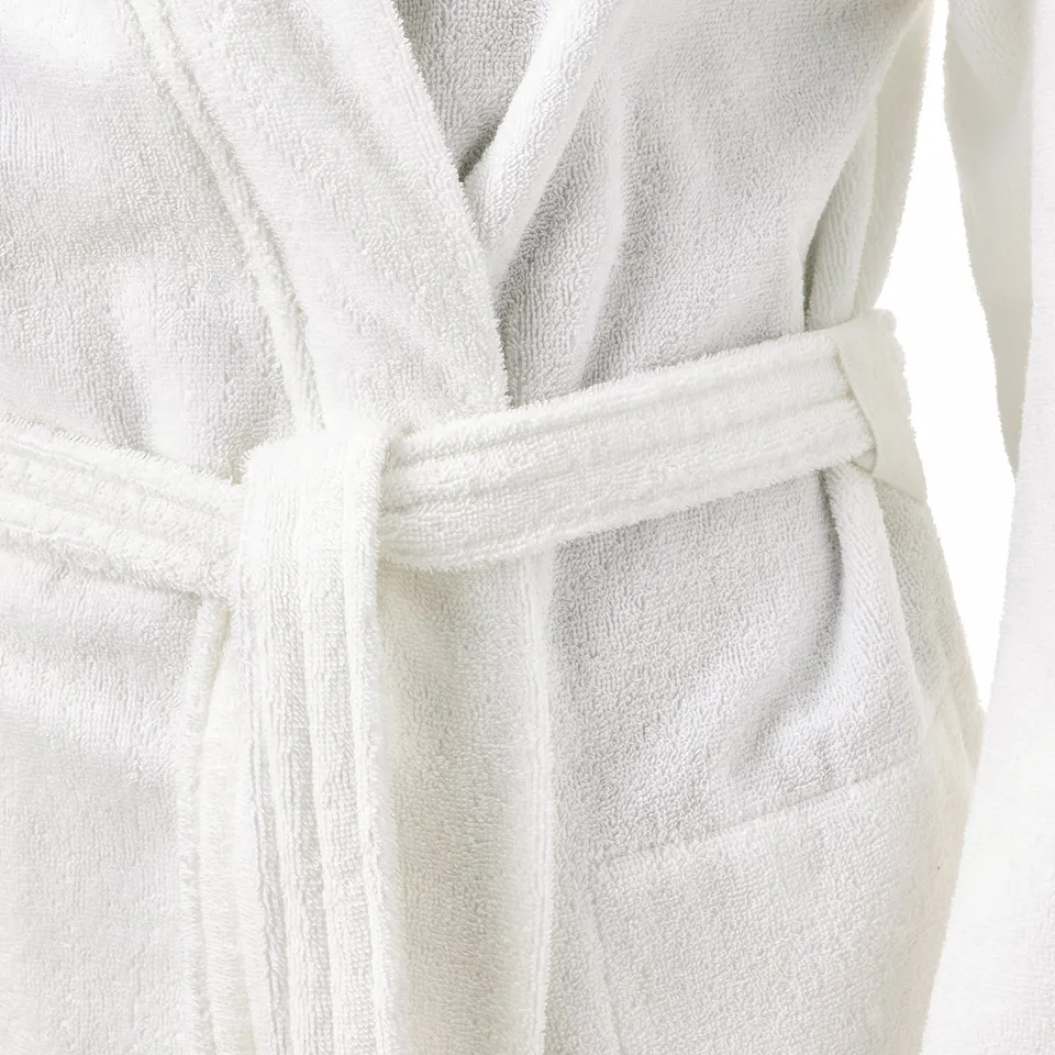 White bathrobe with double-sided terry cloth, adjustable waist belt, and side pockets.