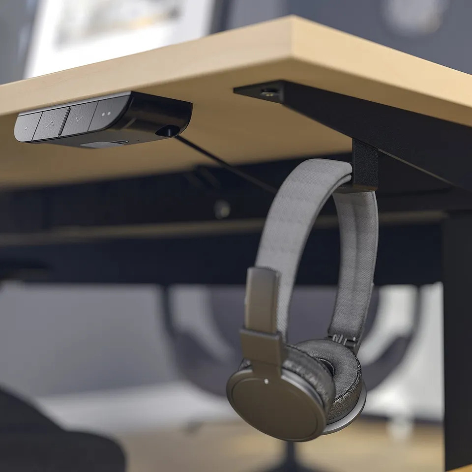 Desk with controls and headphone hook. Dual motors for sitting/standing.