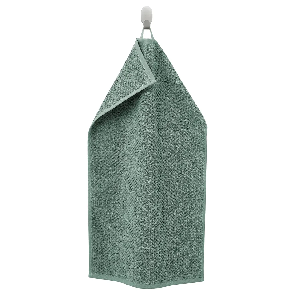 Green GULVIAL cotton towel, rectangular with hooked top, soft and textured.