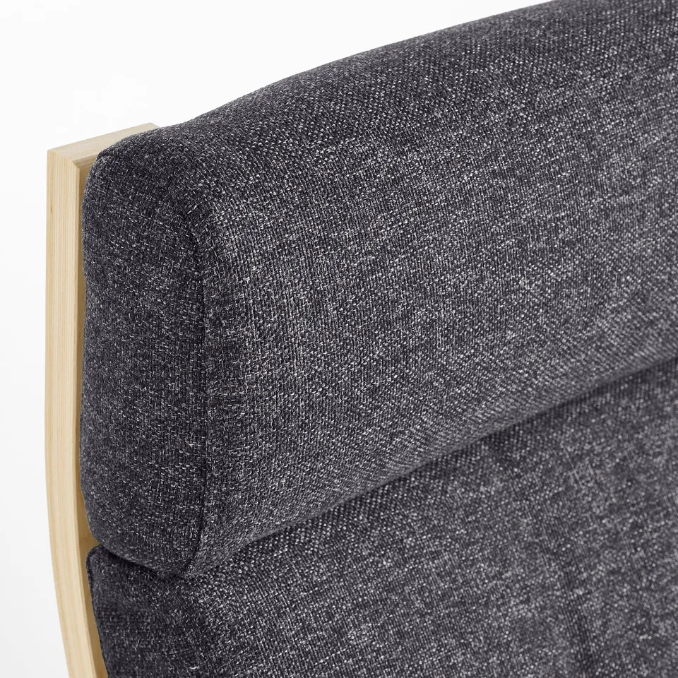 Close-up of a stylish, cushioned rocking chair with smooth, curved wooden frame, offering comfort & support.