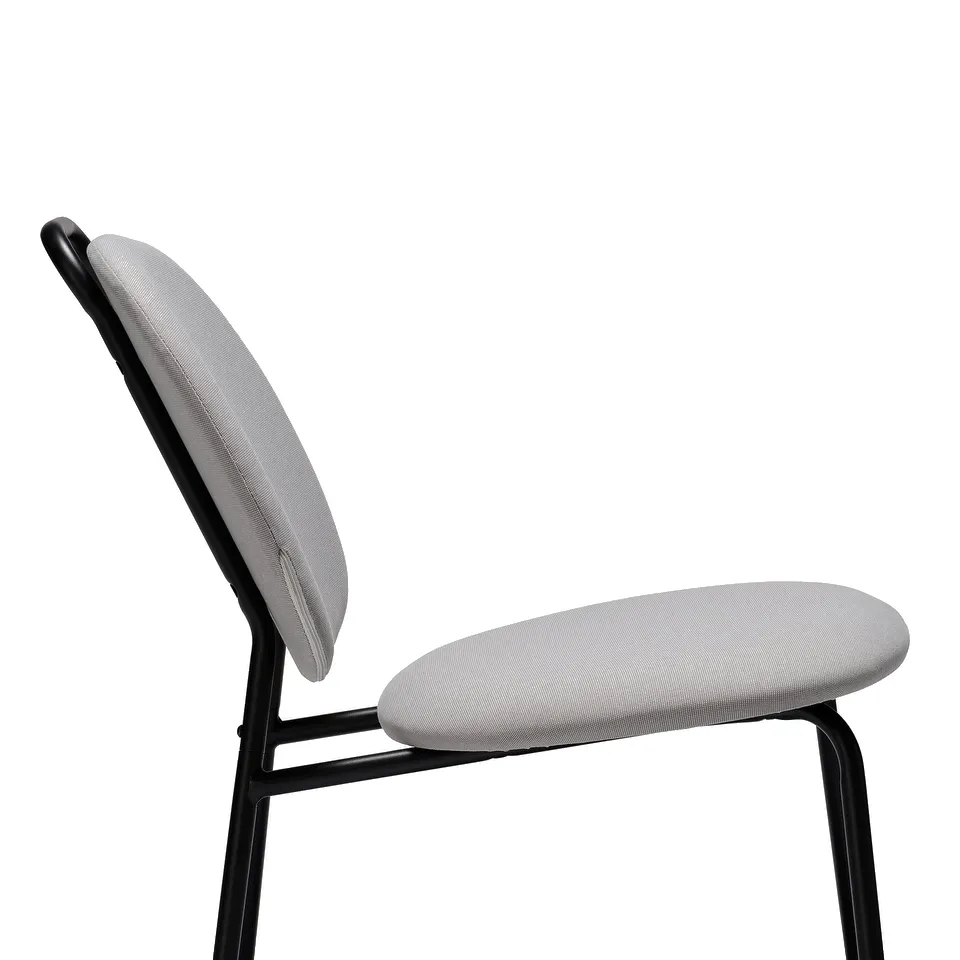 Modern, sleek chair with cushioned seat and back. Lightweight with a handle on backrest. Ideal for varied spaces.