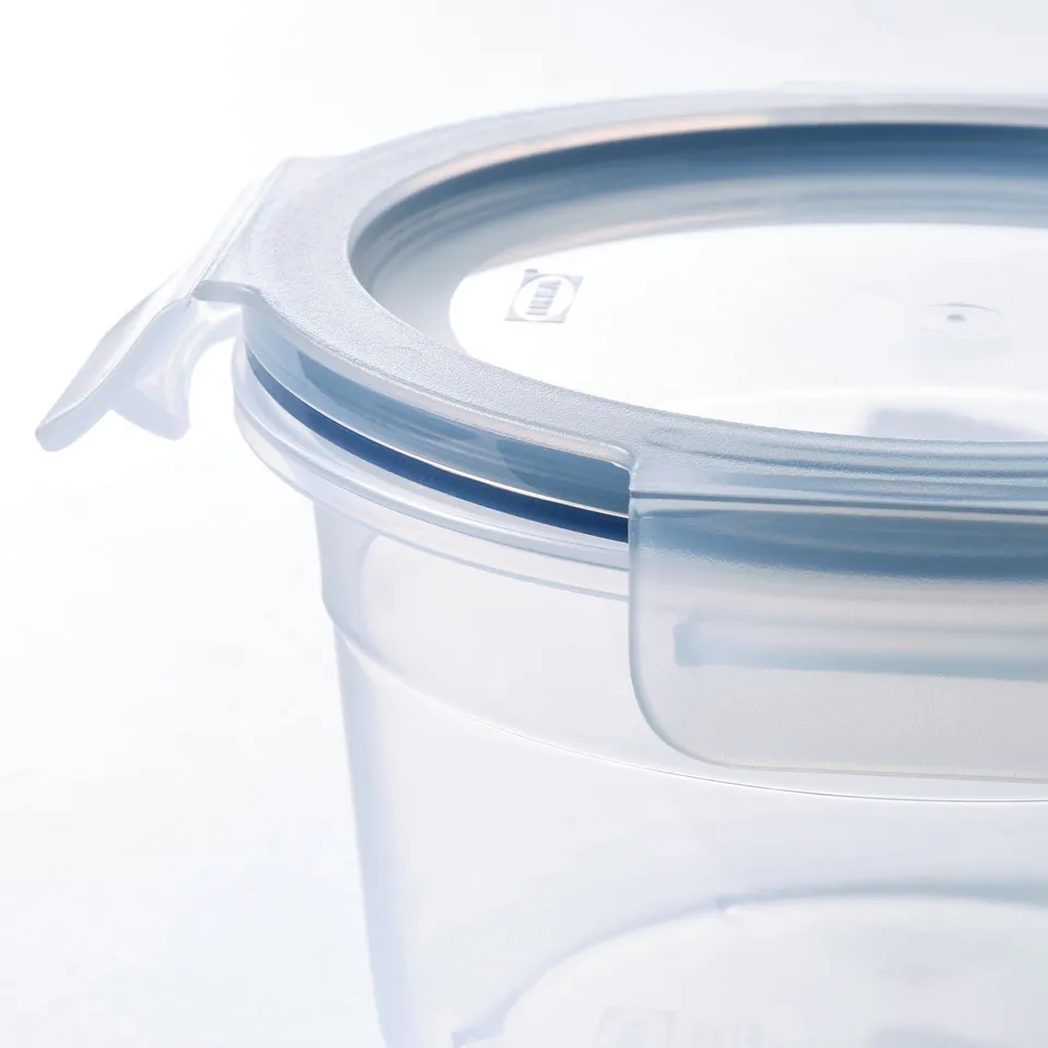 Clear plastic food container with a secure lid and silicone seal, stacked neatly.