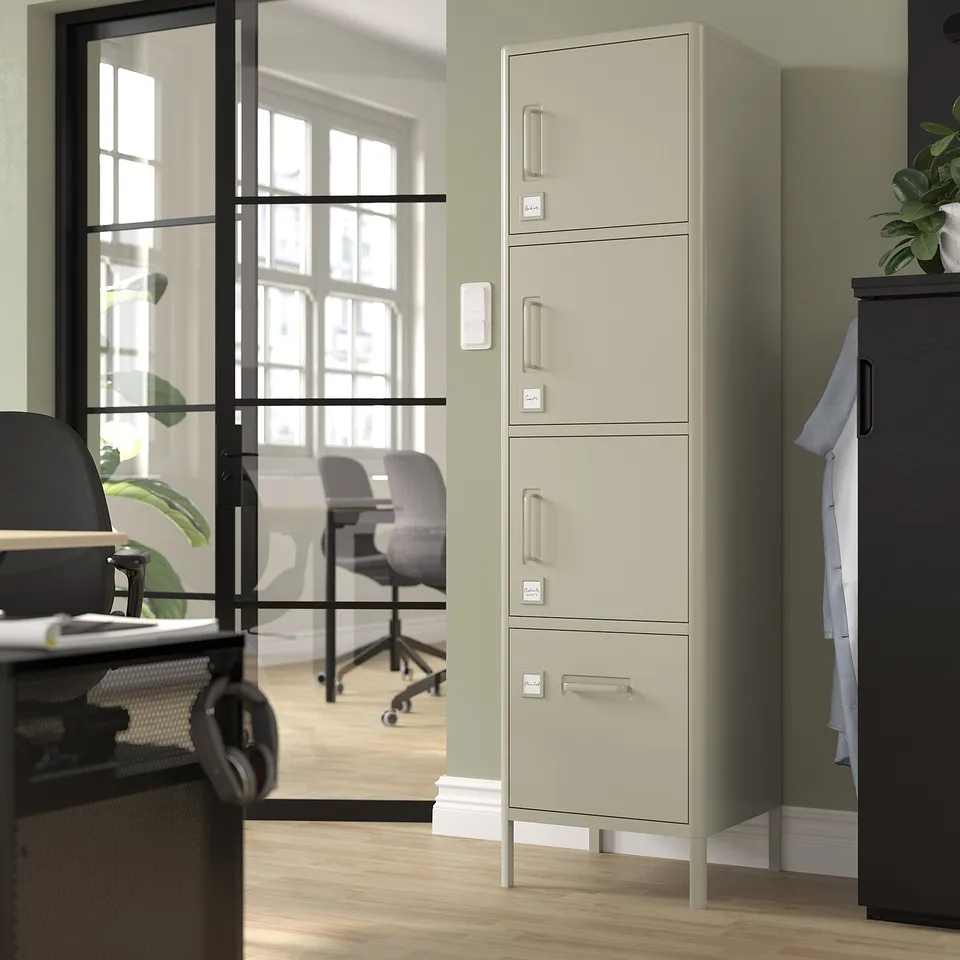 IDÅSEN beige metal locker with 2 doors, 3 drawers in office corner.