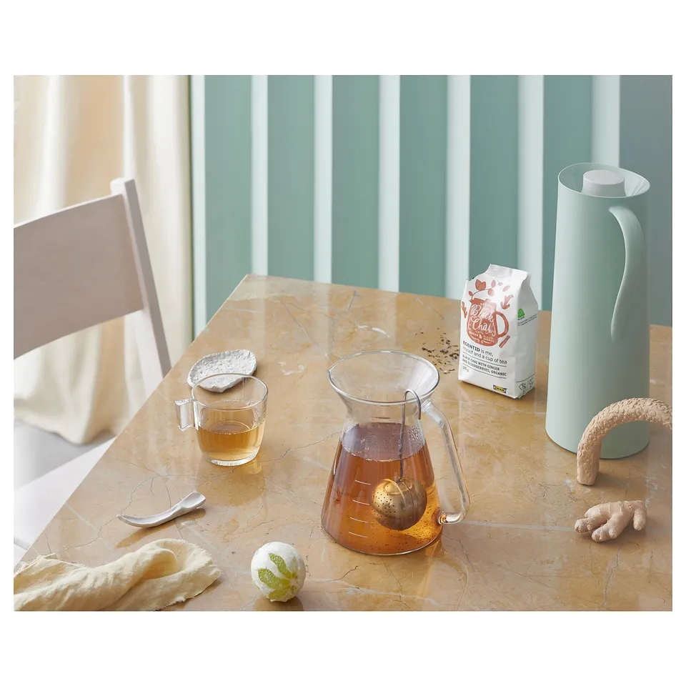 Glass tea mug STELNA on table with tea accessories.
