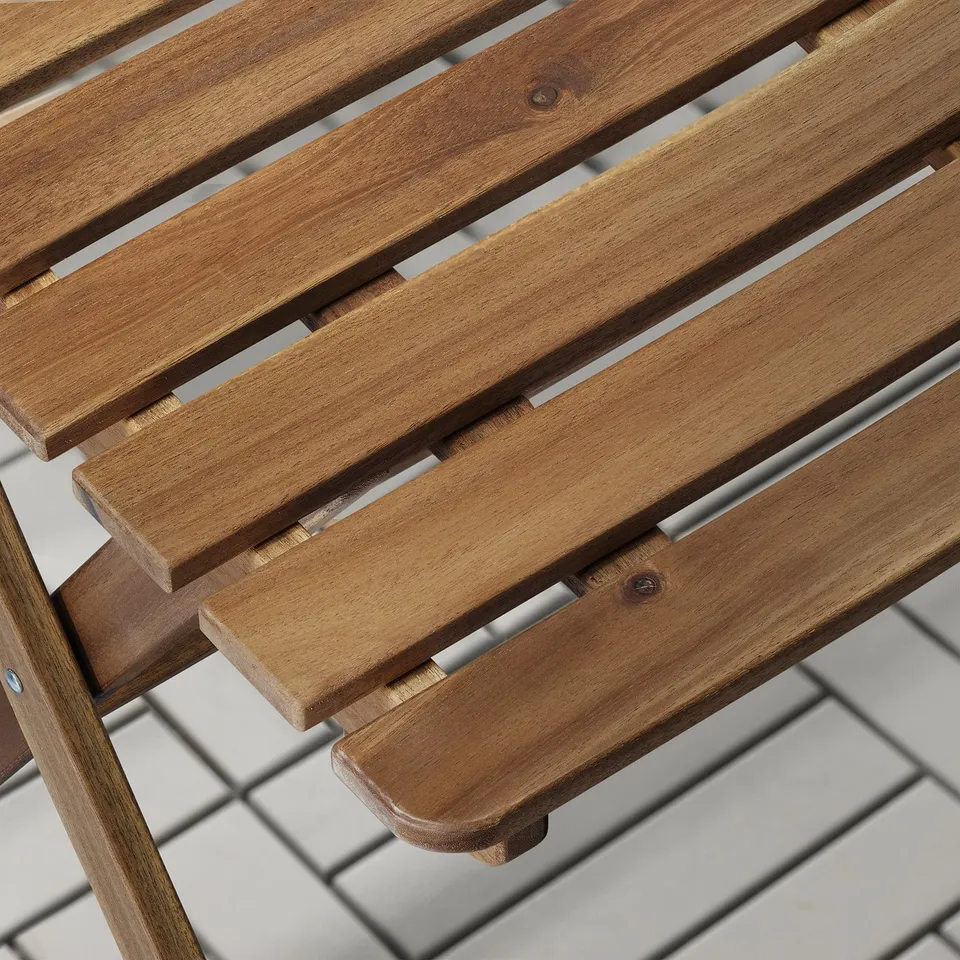 Close-up of a high-quality wooden bench showcasing its polished, sturdy slats.
