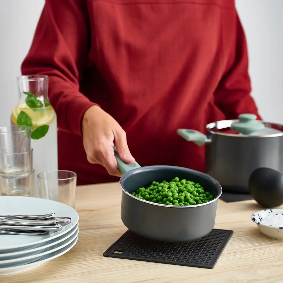 Serving peas, setting table.
