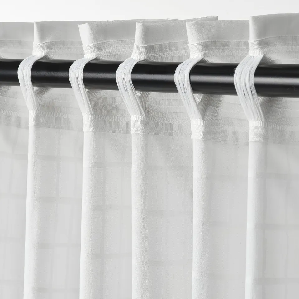 Curtains with white grid pattern; hang with hooks, let in soft light, ensure privacy.