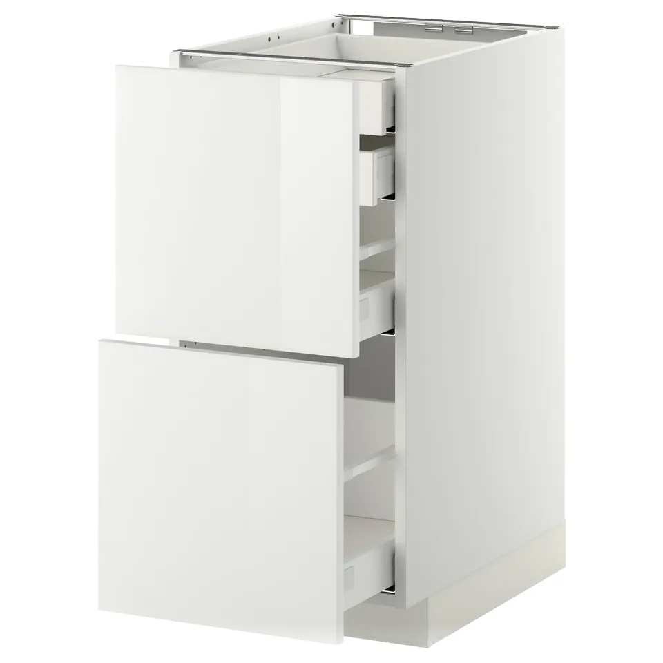 White METOD kitchen cabinet with two open drawers, glossy finish.