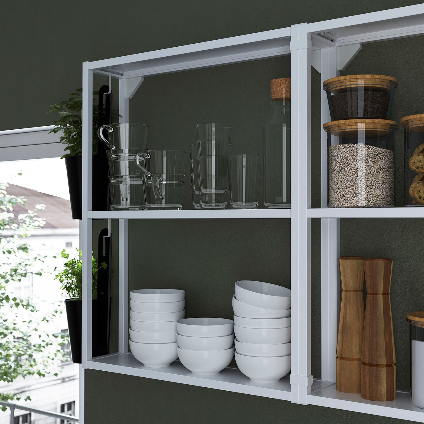Shelf with glass jars, bowls, wooden utensils. Offers open storage for kitchen items.