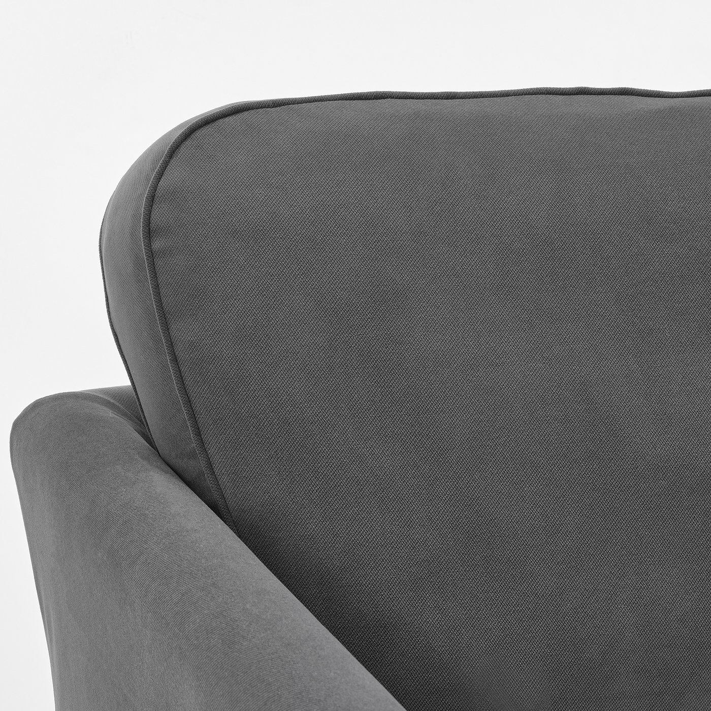 Close-up of plush, grey upholstered sofa showing smooth fabric and seam quality.