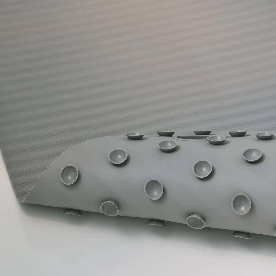 Grey silicone bathtub mat with circular suction cups for non-slip grip and hanging hole.