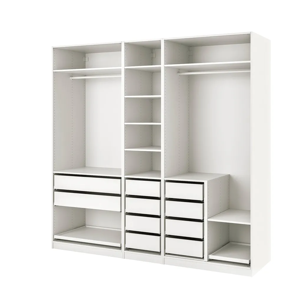 An IKEA PAX wardrobe in white with shelves, drawers, and compartments for storage.