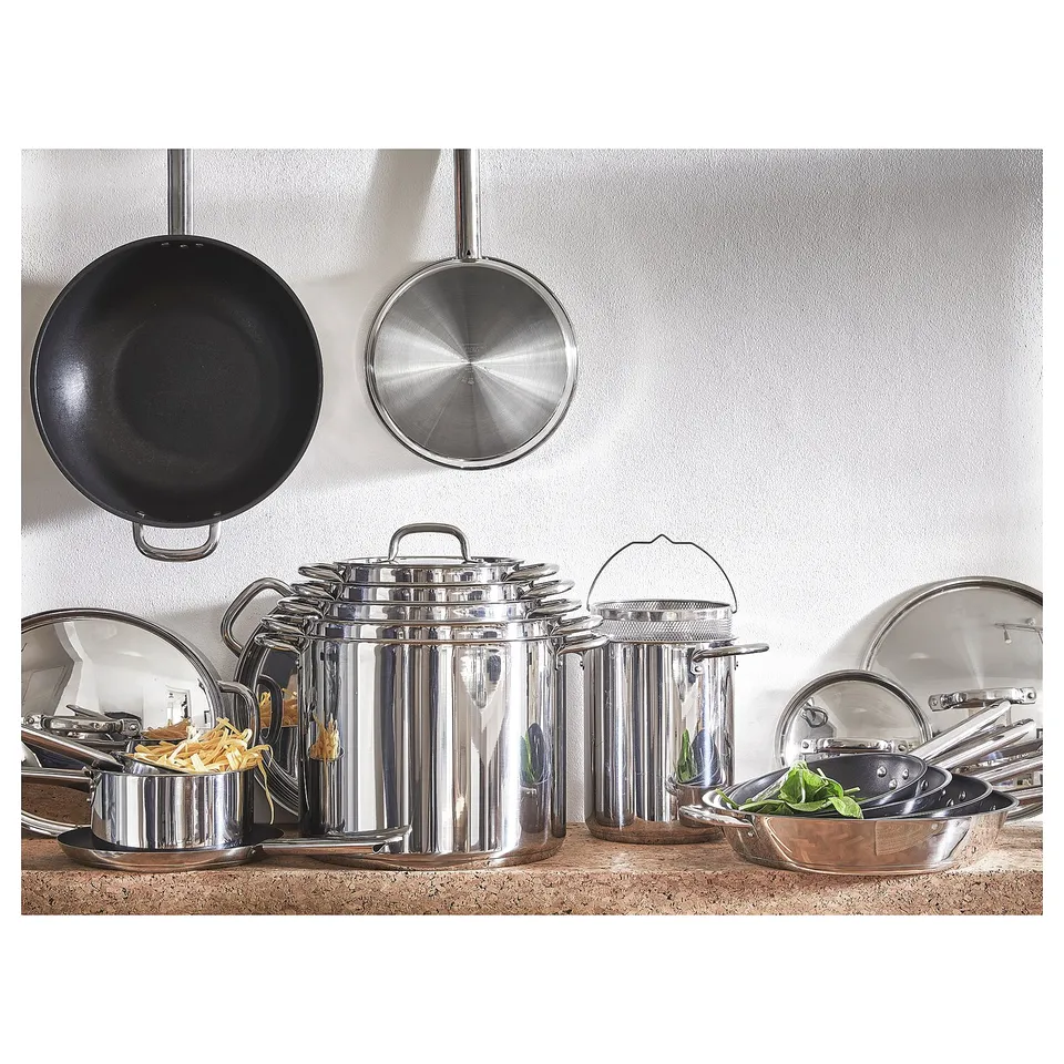 IKEA 365+ stainless steel cookware set: pots, pans, and lids. Modern, shiny design for efficient cooking.