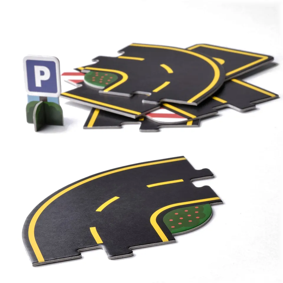 Toy car track set with roads, signs, and playground markings. Made of recycled cardboard for durability and eco-friendly play.