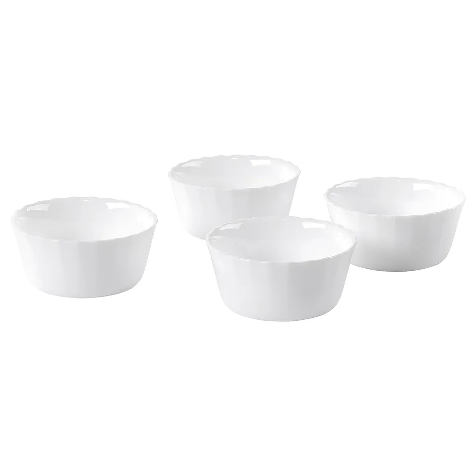 Four white round bowls, made of tempered opal glass, arranged on a white background.
