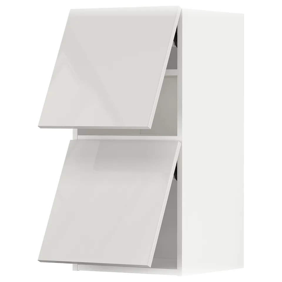 A modern kitchen cabinet in high-gloss grey with open doors, displaying shelves inside.