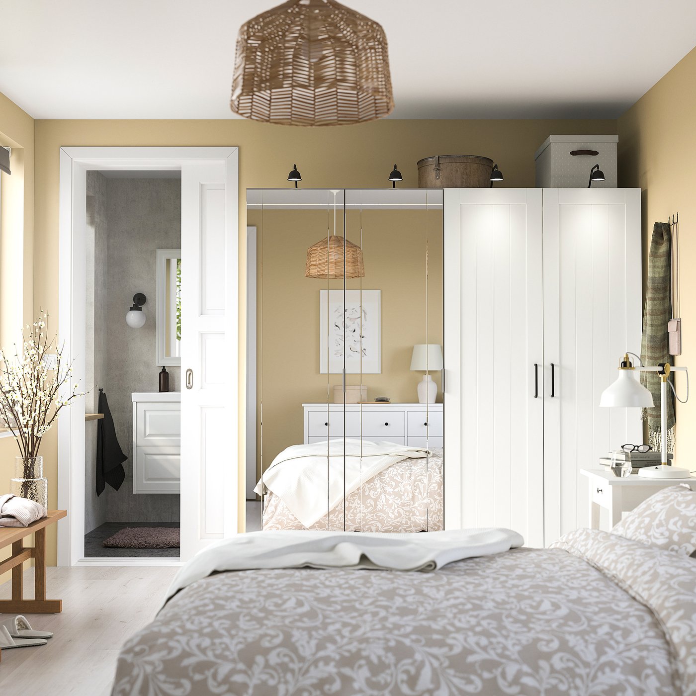 Modern bedroom with KAMMARTORP mirror wardrobe, reflecting decor. Neutral tones create serene atmosphere.