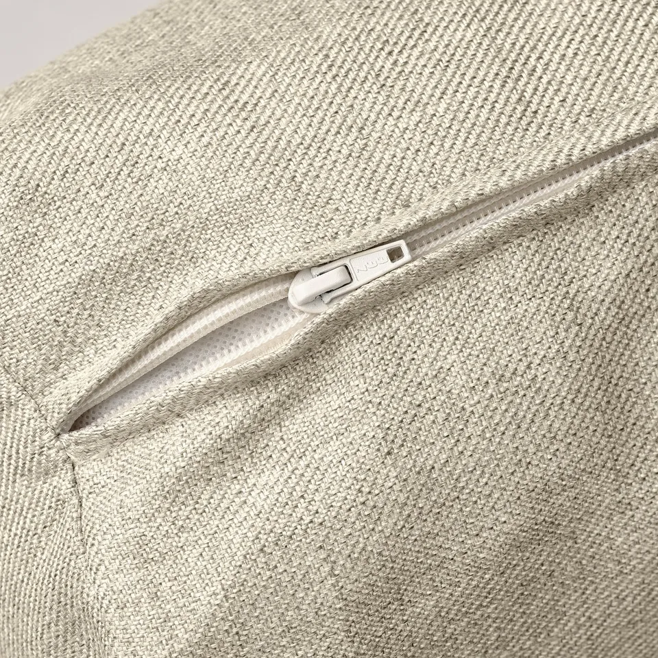 Close-up of sofa-bed zip, showing quality stitching and smooth zip pull.
