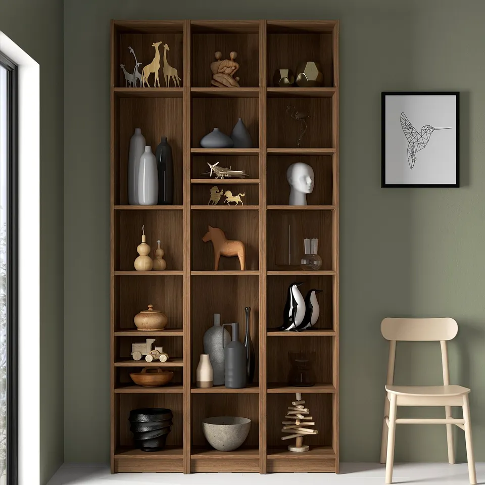 BILLY bookcase with decor, chair, and hummingbird art.