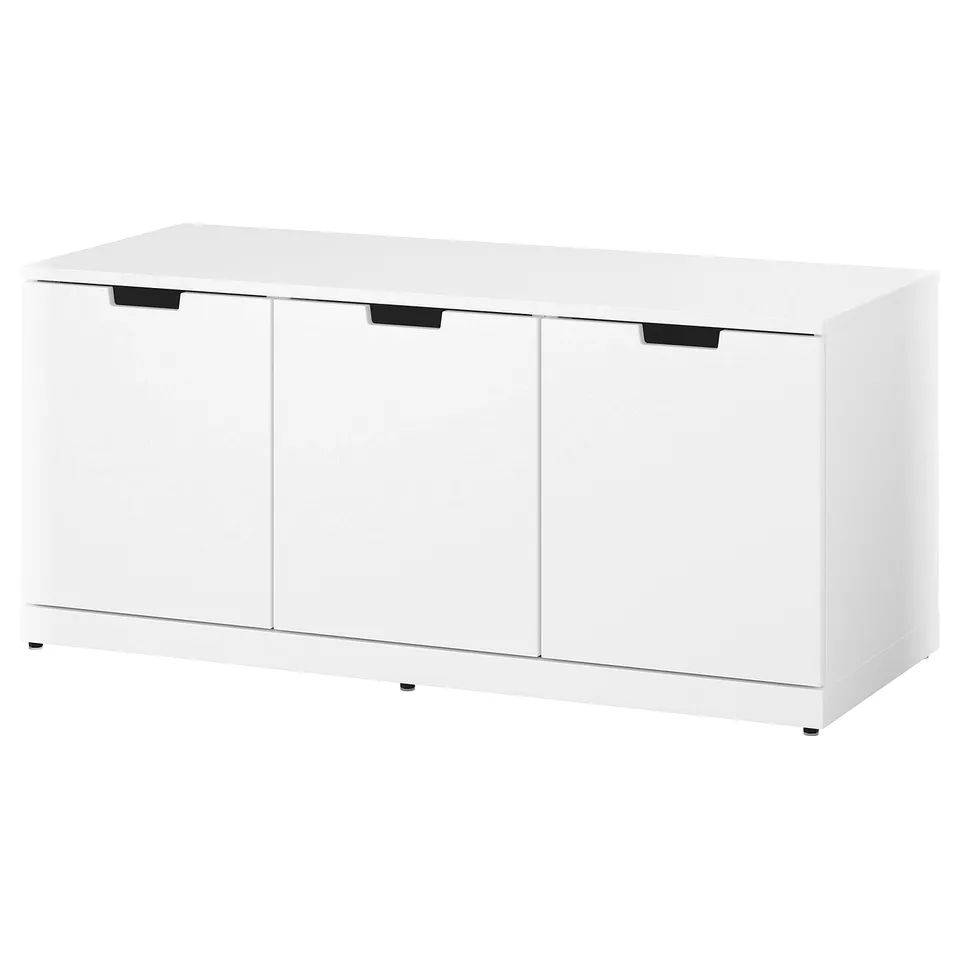 A white NORDLI modular chest of drawers. It three large drawers with clean, modern design and black handles.