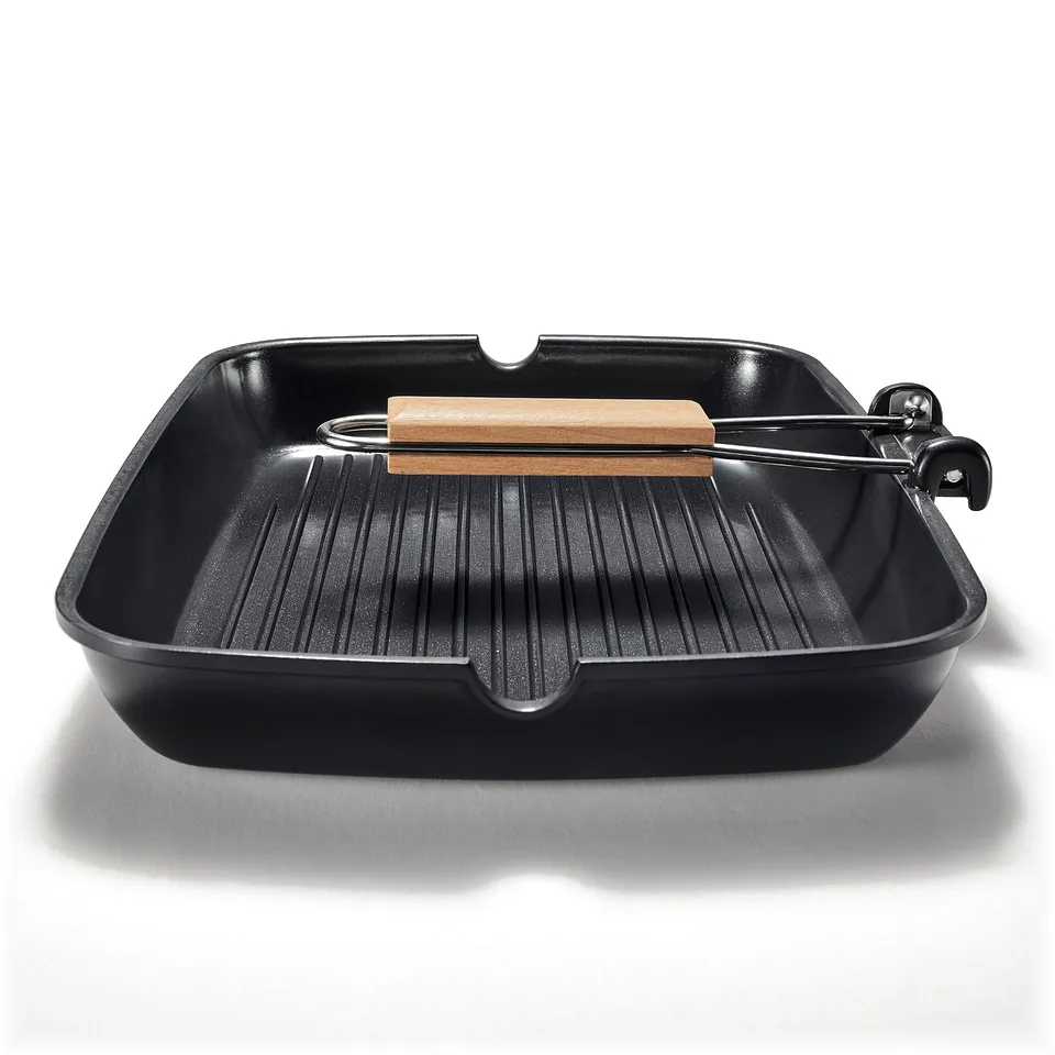 Black grill pan with wooden handle, designed for even heat distribution and easy cleaning, showcasing a durable non-stick coating.