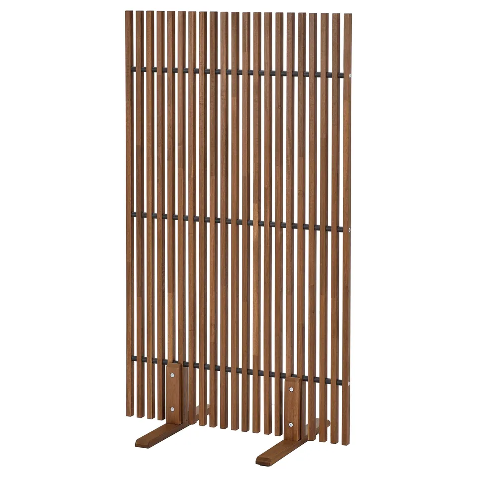 A brown wooden slatted NÄMMARÖ privacy screen with metal joints, designed for outdoor use.